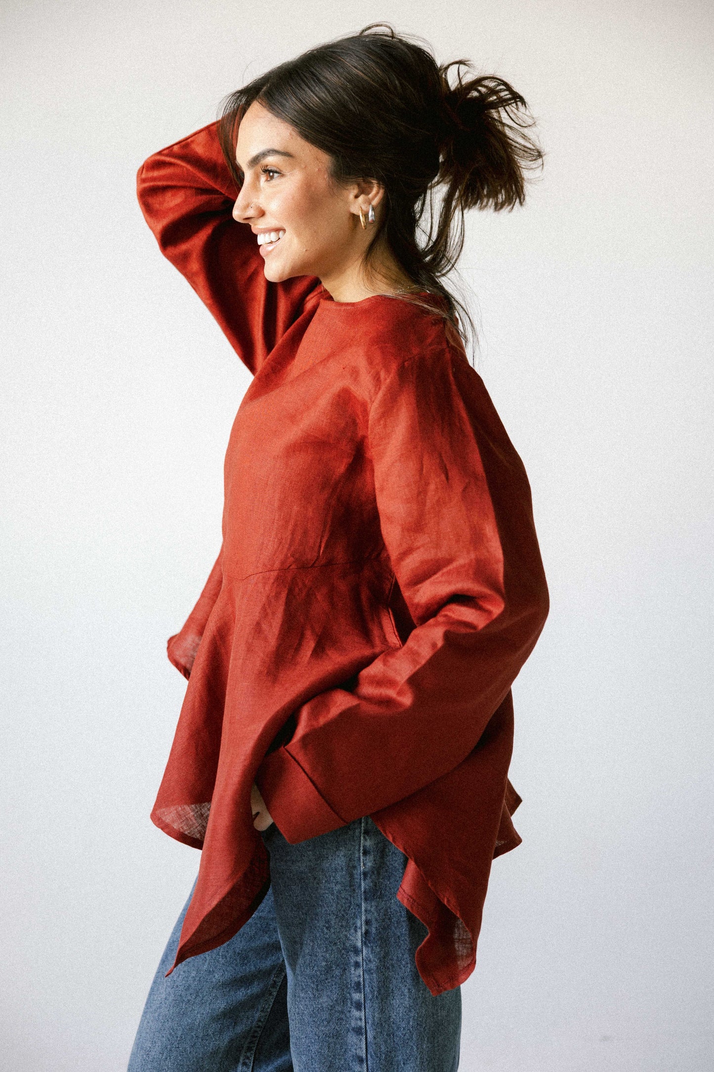 Ruffeled linen top in burnt red