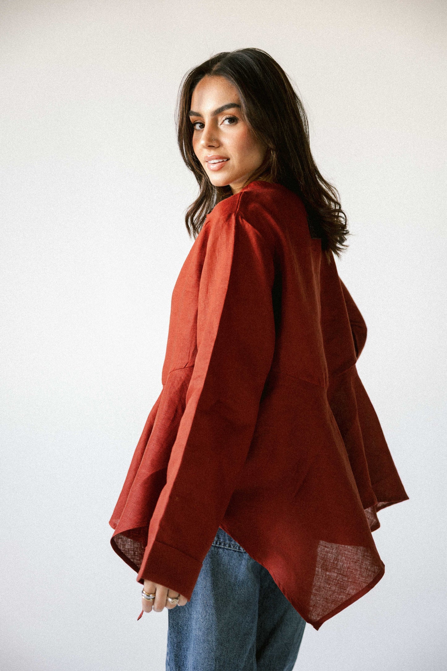 Ruffeled linen top in burnt red